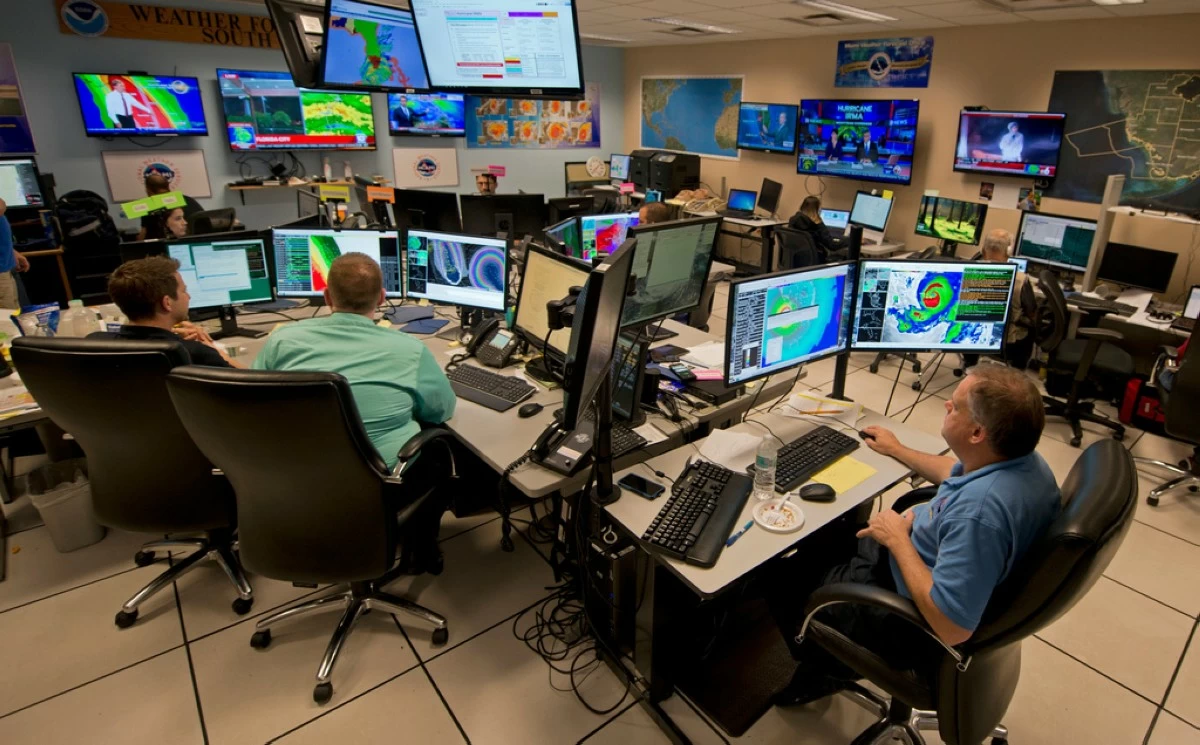 Forecasters at the National Weather Service office monitor Hurricane Irma, Sept. 9, 2017, at the hurricane center in Miami. (AP Photo/Andy Newman, File)