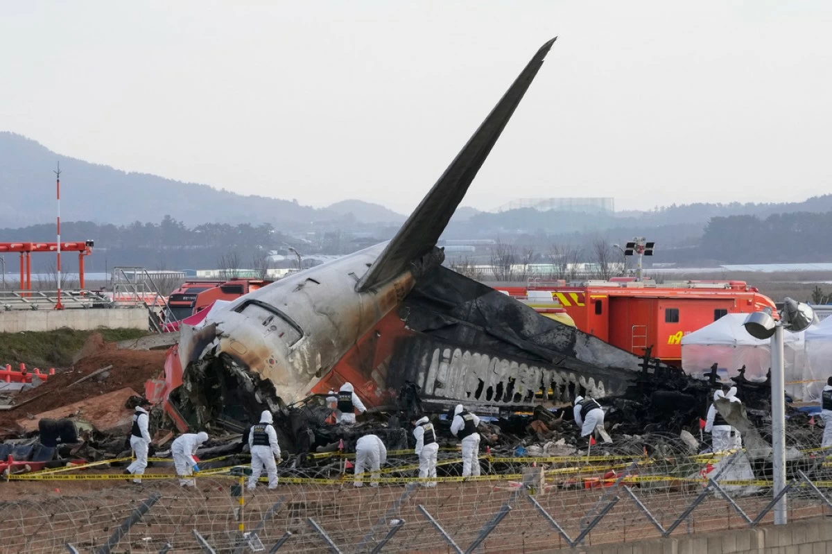 Rescue team members work at the site of a plane crash at Muan International Airport in Muan, South Korea on Dec. 31, 2024. (AP Photo/Ahn Young-joon, File)