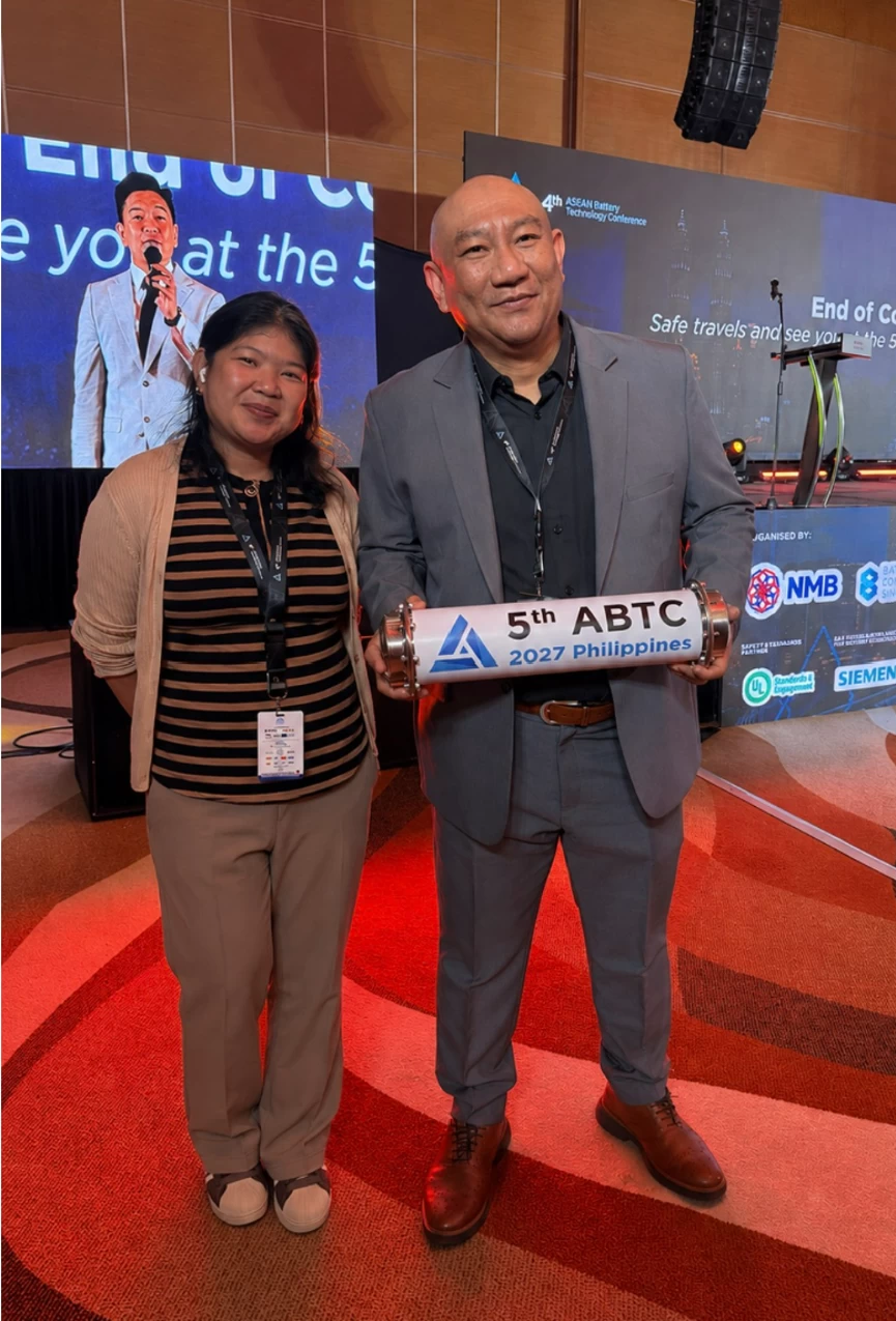Author Millie Manahan stands with Electric Vehicle Association of the Philippines Executive Director Jose Bienvenido Manuel Biona.