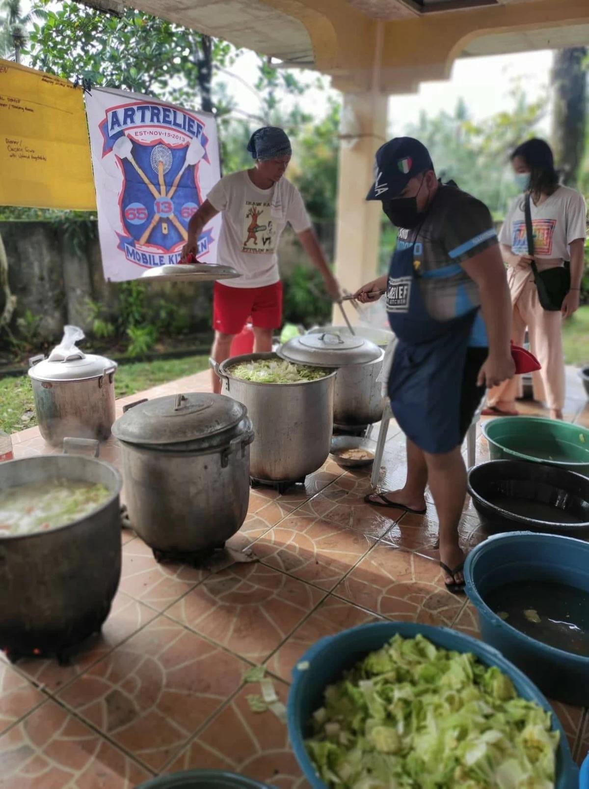 Art Relief Mobile Kitchen volunteers in Mahaplag, Southern Leyte during a relief operation in 2022[A(1.1], helping deliver hot meals to communities in need. (Photo courtesy of Art Relief Mobile Kitchen)