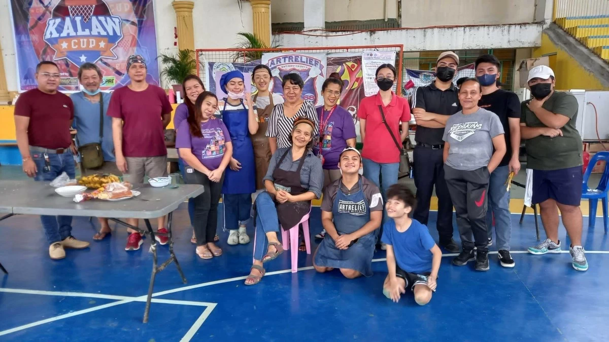 Art Relief Mobile Kitchen team and volunteers with founder Alex and Precious following a relief operation. (Photo courtesy of Art Relief Mobile Kitchen)