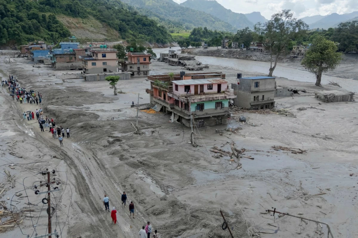 In this photo released by Xinhua News Agency, a drone photo shows a flood-hit area in Nuwakot, Nepal on Thursday, Aug. 27, 2026. (Sulav Shrestha/Xinhua via AP)