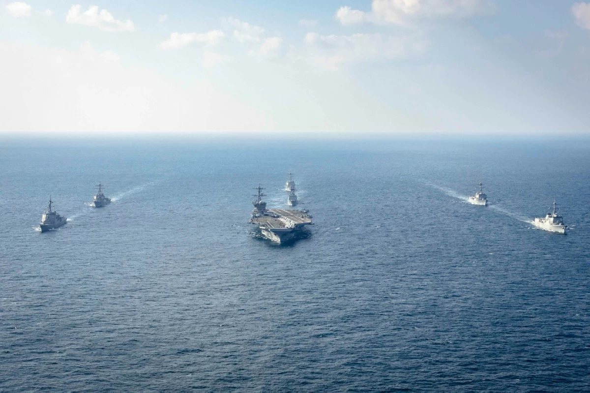 In this photo provided by South Korea Defense Ministry, warships of South Korea, the United States and Japan including the USS George Washington aircraft carrier, bottom center, take part in the trilateral Freedom Edge exercise in international waters off South Korea's southern island of Jeju, on Nov. 13, 2024. (South Korea Defense Ministry via AP, File)