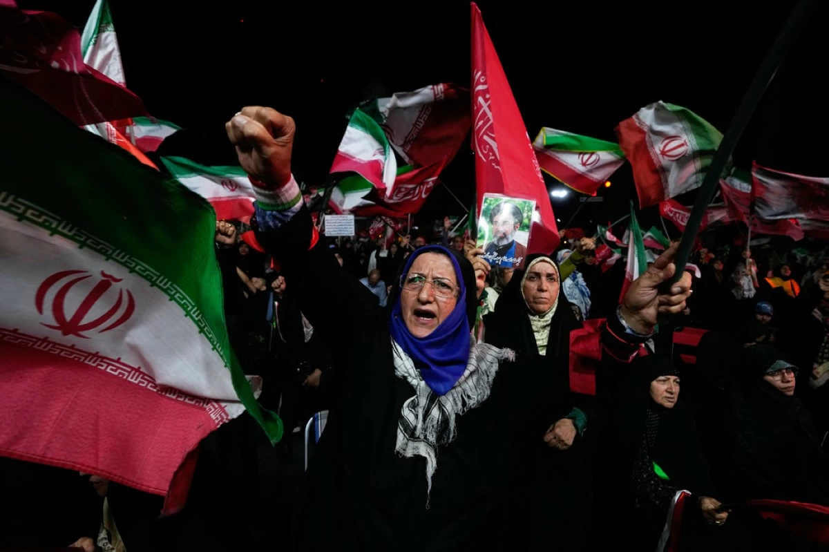 A pro-government demonstrator chants slogan during a gathering in a square in Tehran, Wednesday, Aug. 26, 2026. (AP Photo/Vahid Salemi)