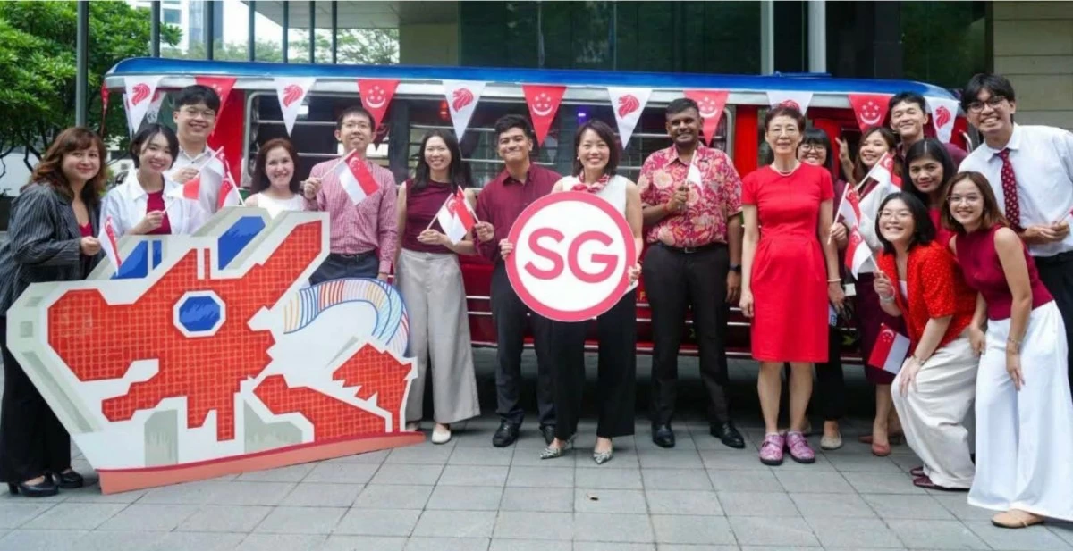 Ambassador Constance See and the Singapore Embassy staff pose before an iconic red jeepney–a proud symbol of friendship and camaraderie between Singapore and the Philippines.