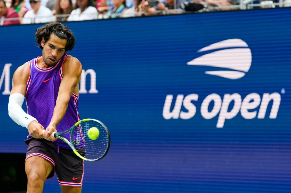 Carlos Alcaraz, of Spain, returns the ball during a mixed doubles match at the U.S. Open tennis championships, Tuesday, Aug. 25, 2026, in New York. (AP Photo/Yuki Iwamura)