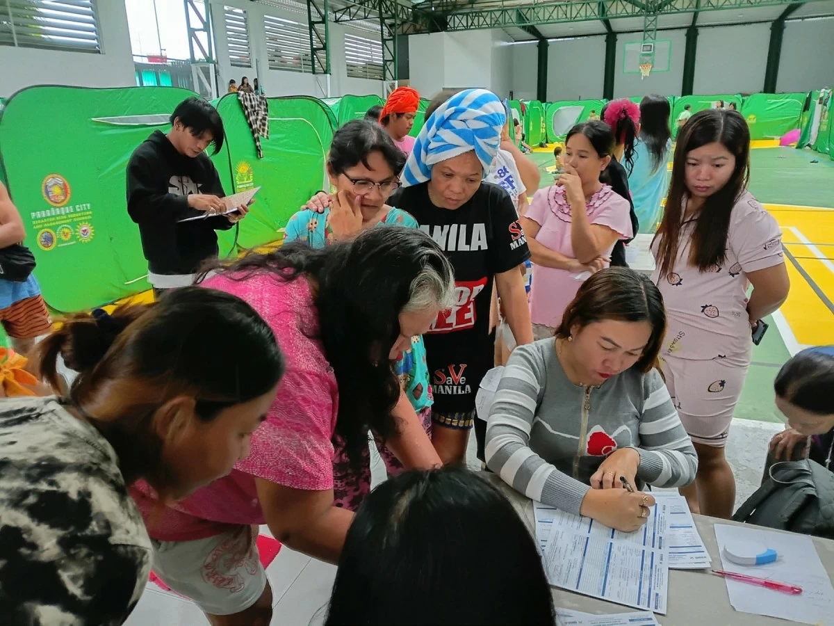 
Evacuees take shelter at the Palanyag Gymnasium as heavy rains brought by the southwest monsoon, or habagat, continue to affect several areas (Photo from  Parañaque PIO)

