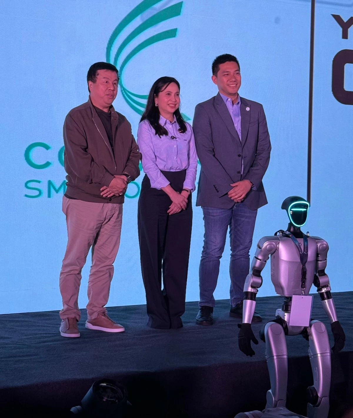Dennis Uy of Converge ICT Solutions, Inc, DTI Sec. Cristina Roque, and Dindo Marzan of the SME Group; at the DTI AI and Scale Up Center.