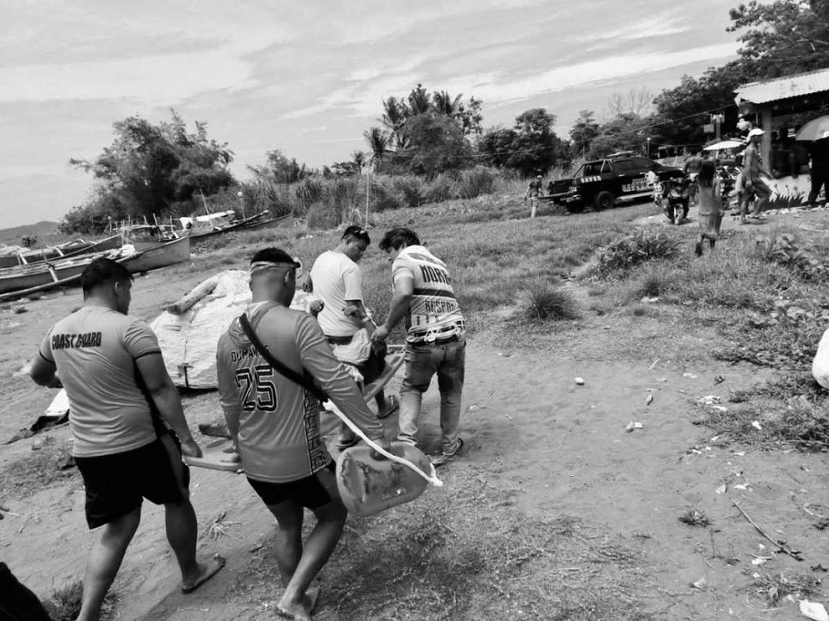 SEARCH ENDS IN TRAGEDY: Coast Guard personnel recover the lifeless body of a 54-year-old fisherman who was reported missing after his motor banca was found aground in Barangay Palawig, Santa Ana, Cagayan.   (Photo courtesy of Coast Guard via Liezle Inigo)