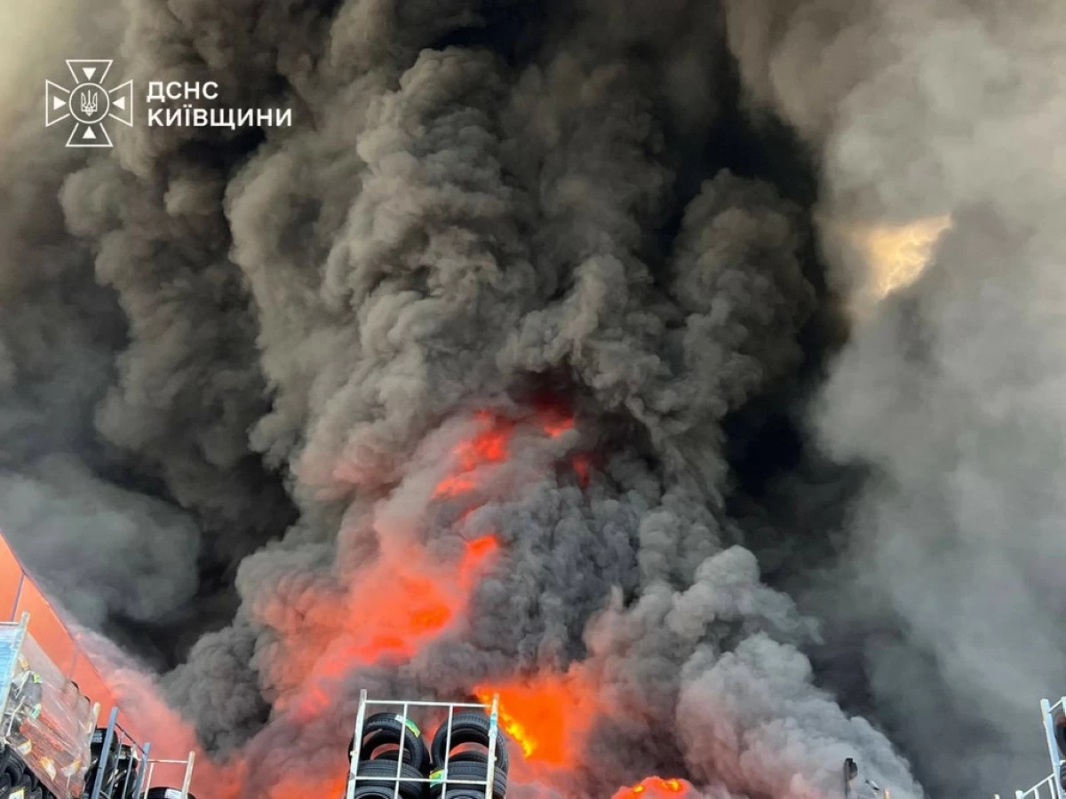 In this photo provided by the Ukrainian Emergency Service, firefighters put out a fire in a warehouse following a Russian drone attack near Kyiv, Ukraine, Saturday, Aug. 29, 2026. (Ukrainian Emergency Service via AP)
