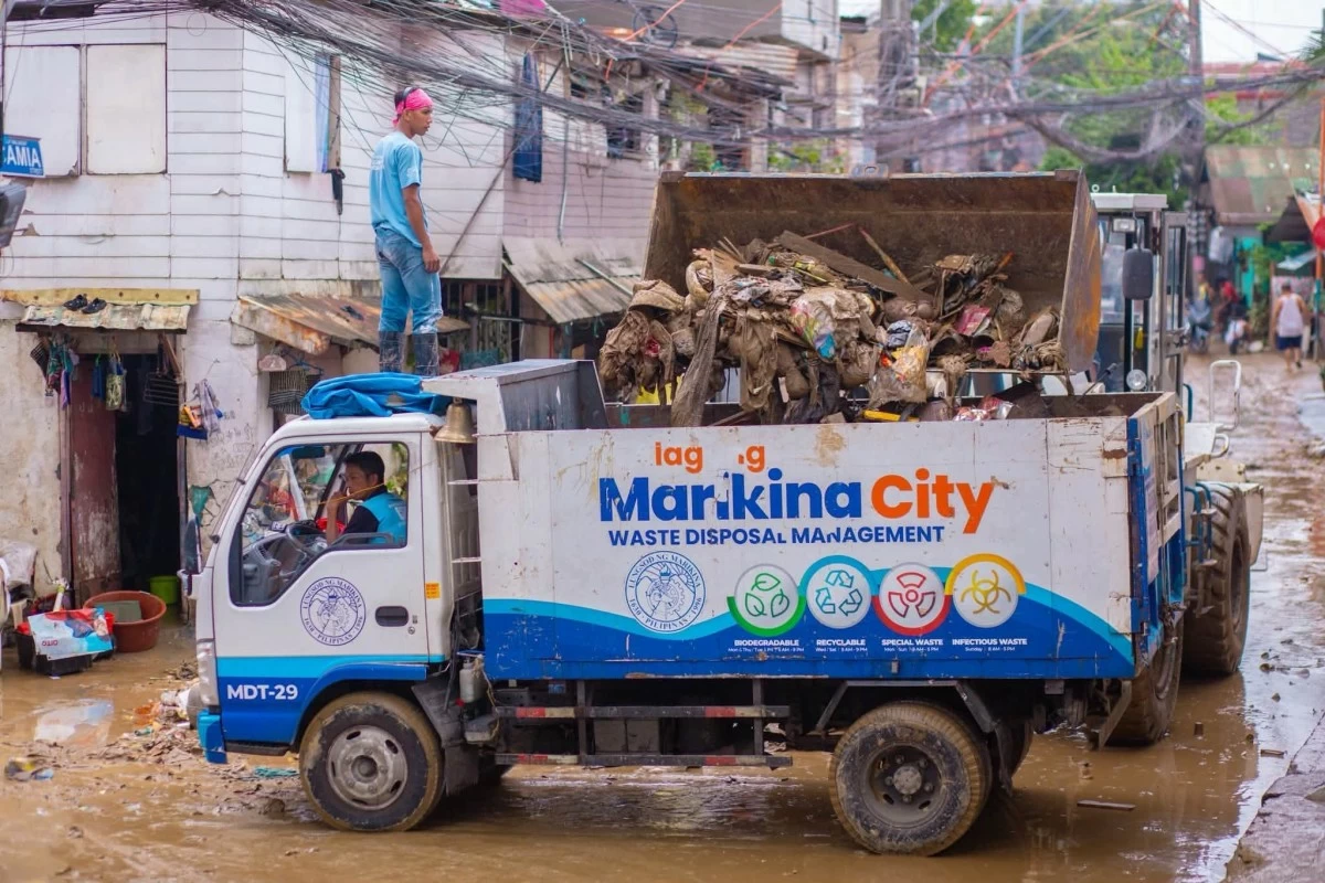 The Marikina City government deploys skid loaders, heavy equipment, and clearing personnel to quickly haul away garbage, mud, and debris left by the floods in Malanday and Tumana. (Photos from Marikina PIO)