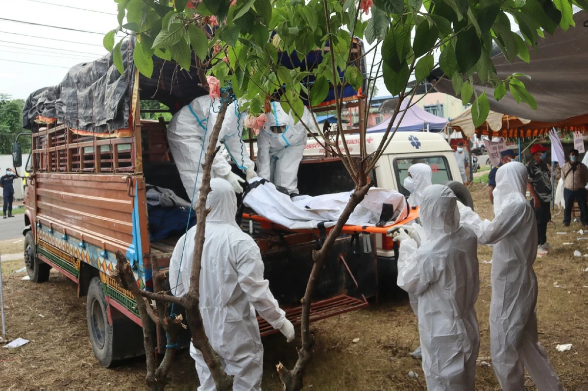 Rescuers carry bodies of flash flood victims for a mass burial in Chitwan, Nepal, Saturday, Aug. 29, 2026. (AP Photo/Nisha Shrestha)
