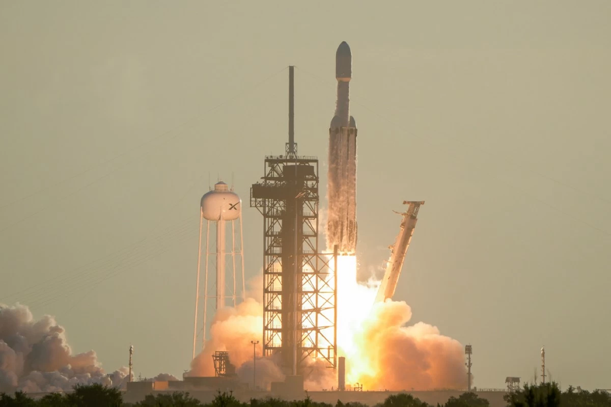 A SpaceX Falcon Heavy rocket with the space observatory Roman Telescope lifts off from launch complex 39A at the Kennedy Space Center in Cape Canaveral, Fla., Sunday, Aug. 30, 2026. (AP Photo/John Raoux)