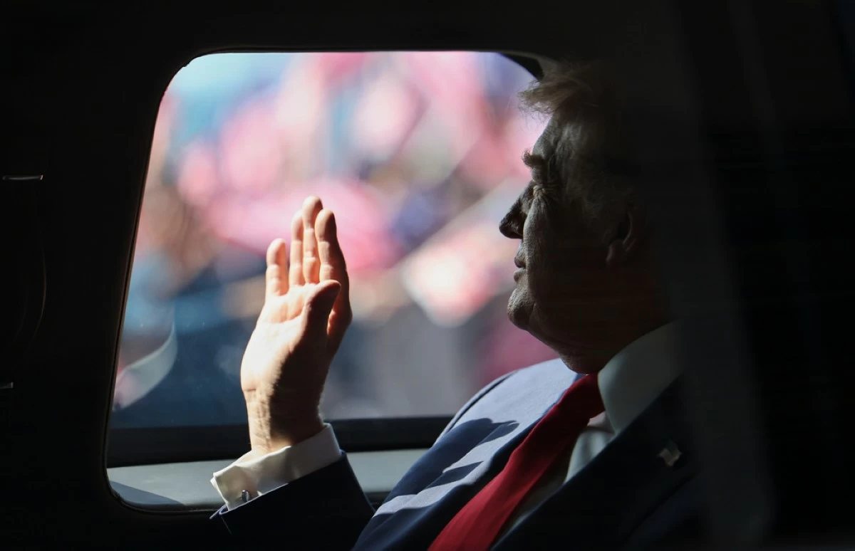 U.S. President Donald Trump waves from his official vehicle as he heads to attend the 47th Association of Southeast Asian Nations (ASEAN) summit after arriving at Kuala Lumpur International Airport in Kuala Lumpur, Malaysia, Sunday, Oct. 26, 2025. (Hasnoor Hussain/Pool Photo via AP/File)