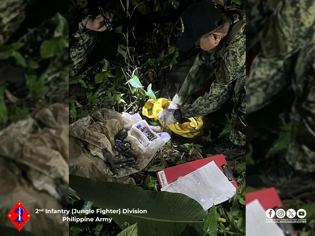Government forces unearthed an arms cache upon information given by a rebel returnee in Barangay Sta. Rosa in Lopez, Quezon on Aug. 28. (Photo via Danny Estacio)


