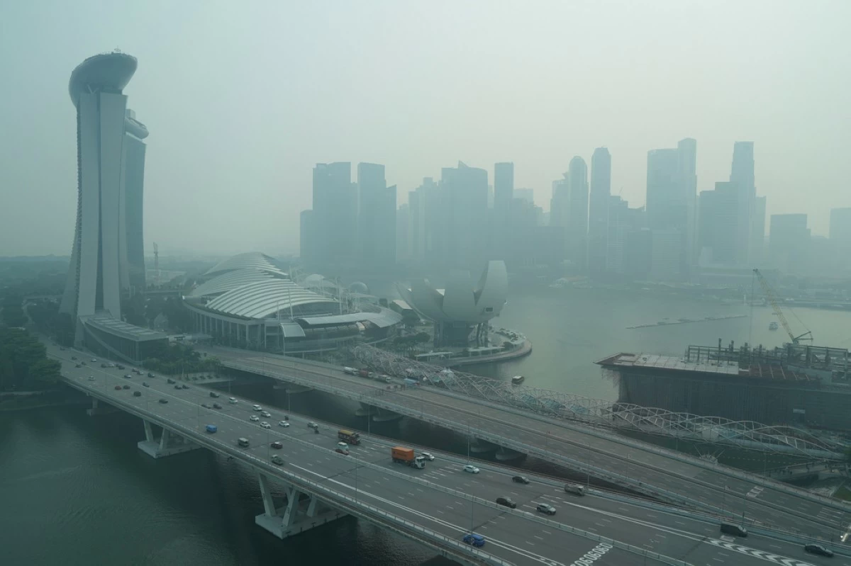 A thick haze obscures the skyline behind the Central Business District area in Singapore, Friday, Oct. 9, 2026. (AP Photo/David Hu, File)