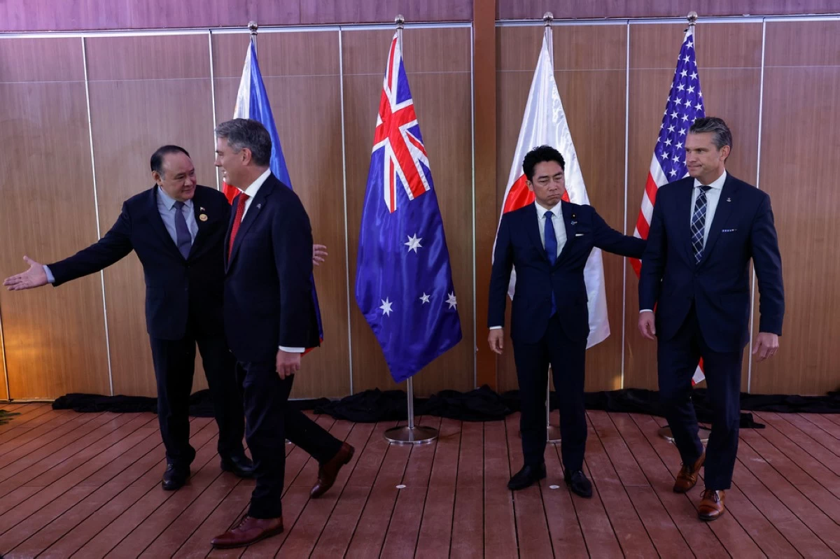 From left, Philippines Defense Secretary Gilberto Teodoro, Australia Defense Minister Richard Marles, Japan Defense Minister Shinjiro Koizumi and U.S.Defense Secretary Pete Hegseth prepare to leave after posing for pictures before holding a Quadrilateral Meeting on the sidelines of the 20th Association of Southeast Asian Nations (ASEAN) Defence Ministers' Meeting (ADMM) and 13th ADMM-Plus Meetings in Cebu, Philippines, Wednesday, Oct. 28, 2026. .(Rolex Dela Pena/Pool Photo via AP)