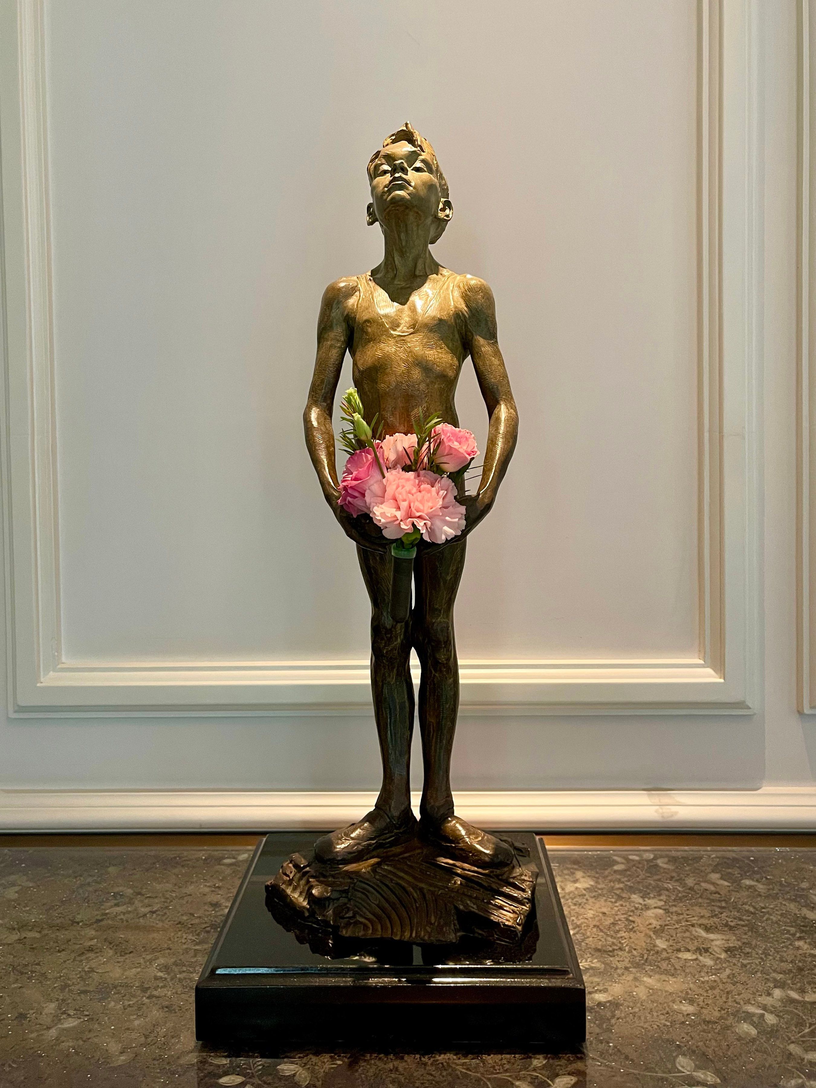 11 _Boy with Flower,_ carries a fresh bouquet of flowers everyday. It's the hotel's most photographed art piece.jpg