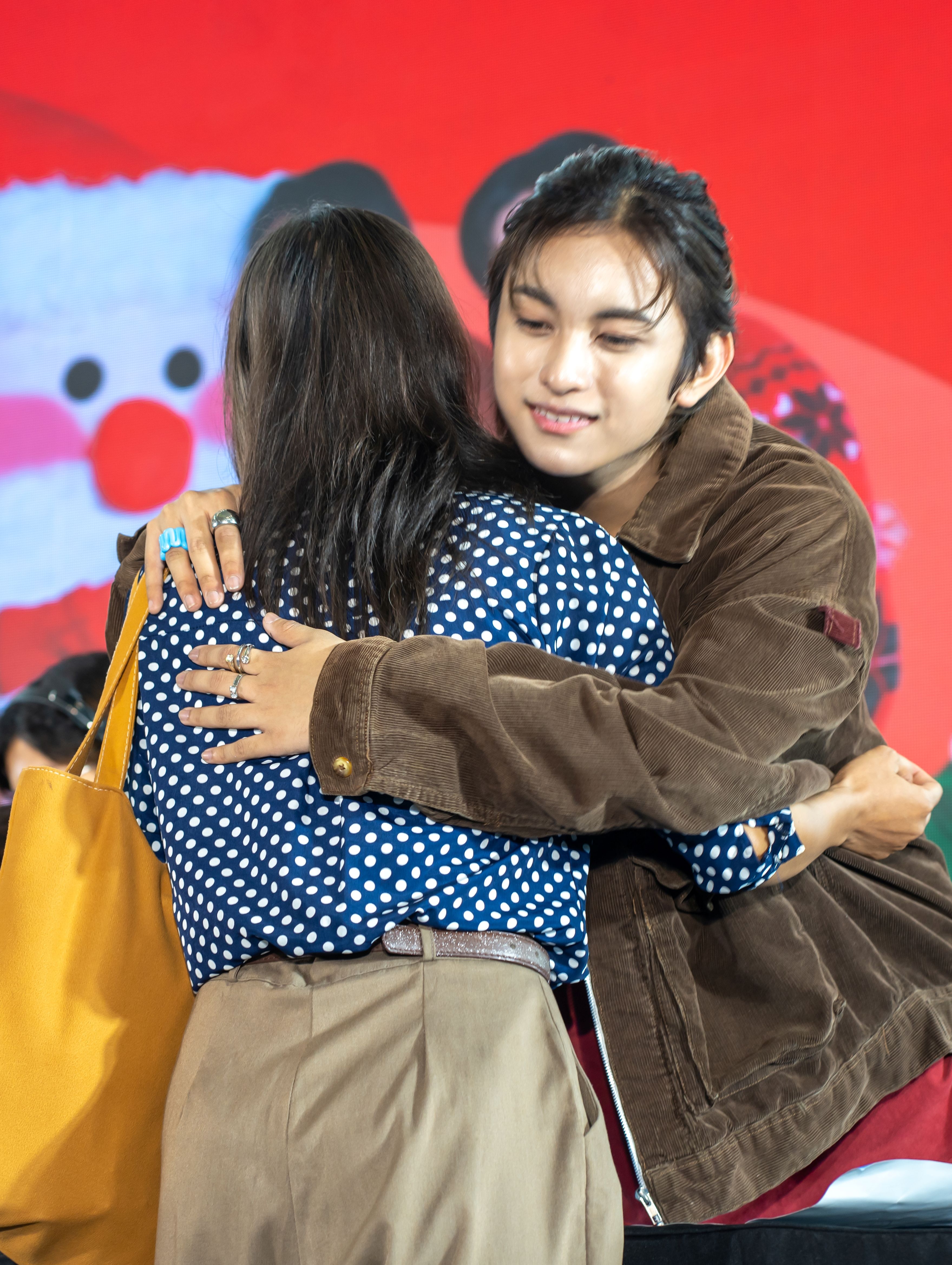 5 HORI7ON’s Marcus embraces an eager fan during the meet and greet..JPG