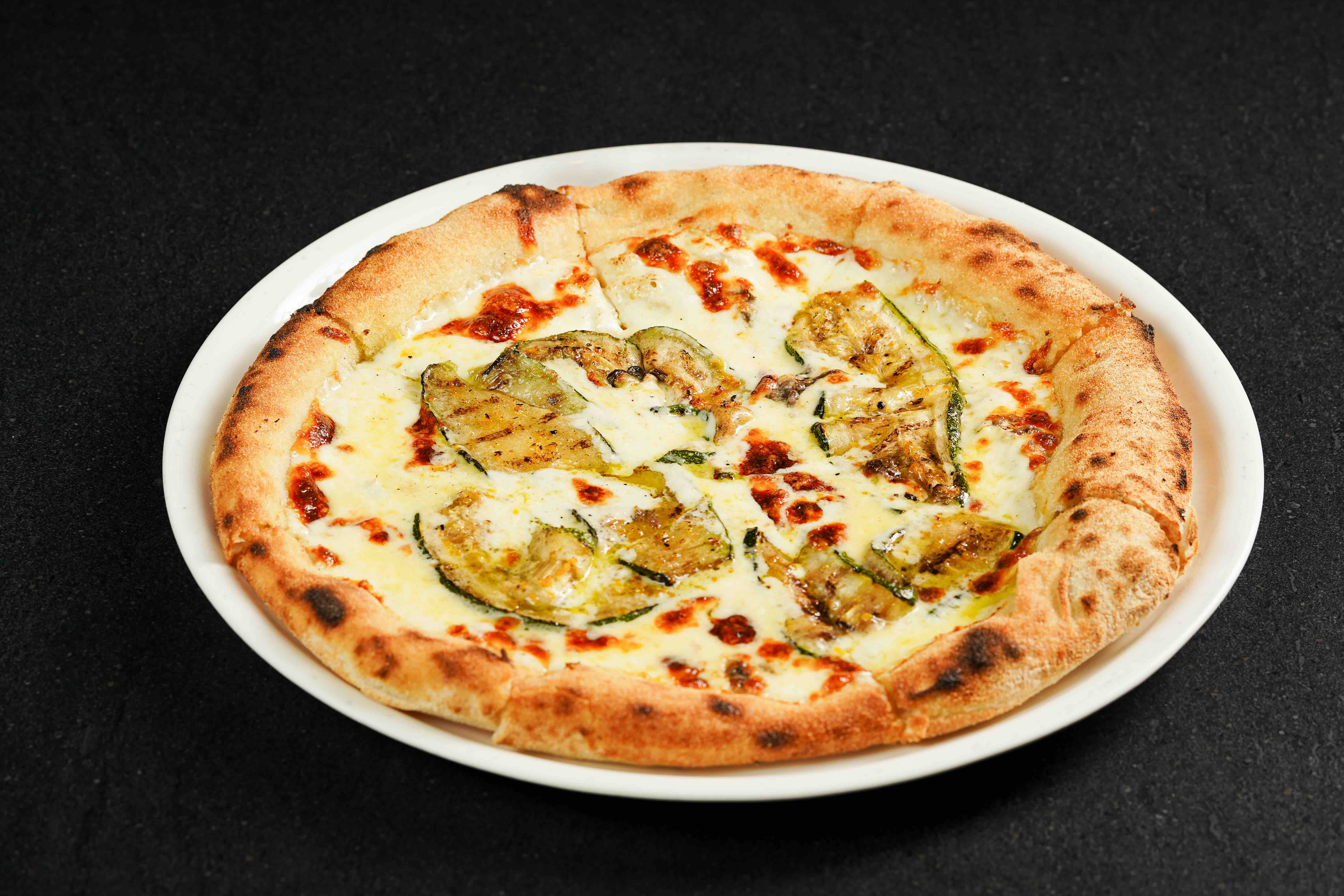 ACCIUGHE E ZUCCHINE Pizza topped with anchovy, zucchini, and ricotta (1).jpeg