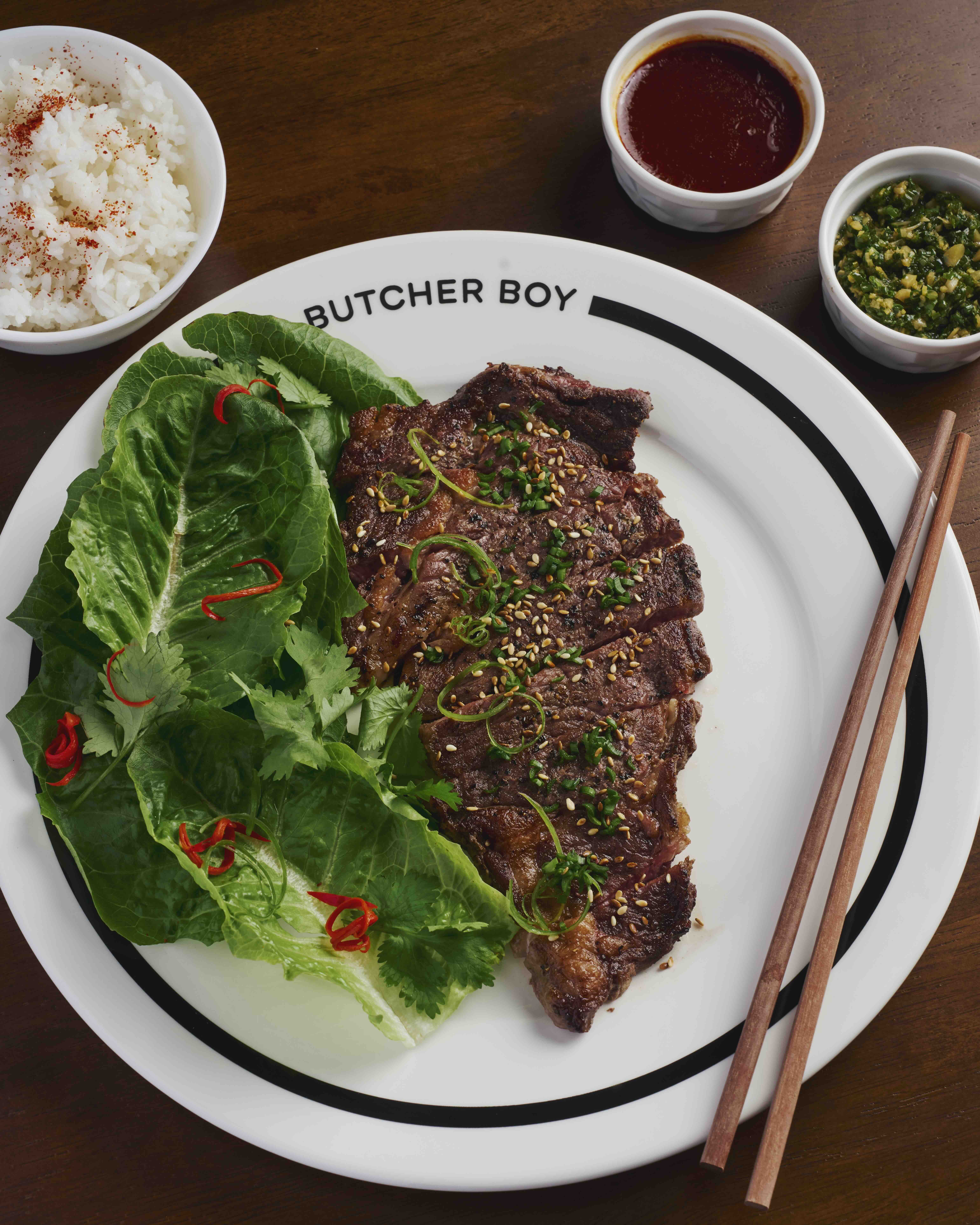 BEEF BO SSAM Beef ribeye with bo ssam sauce, scallion dressing, and Japanese rice.jpeg