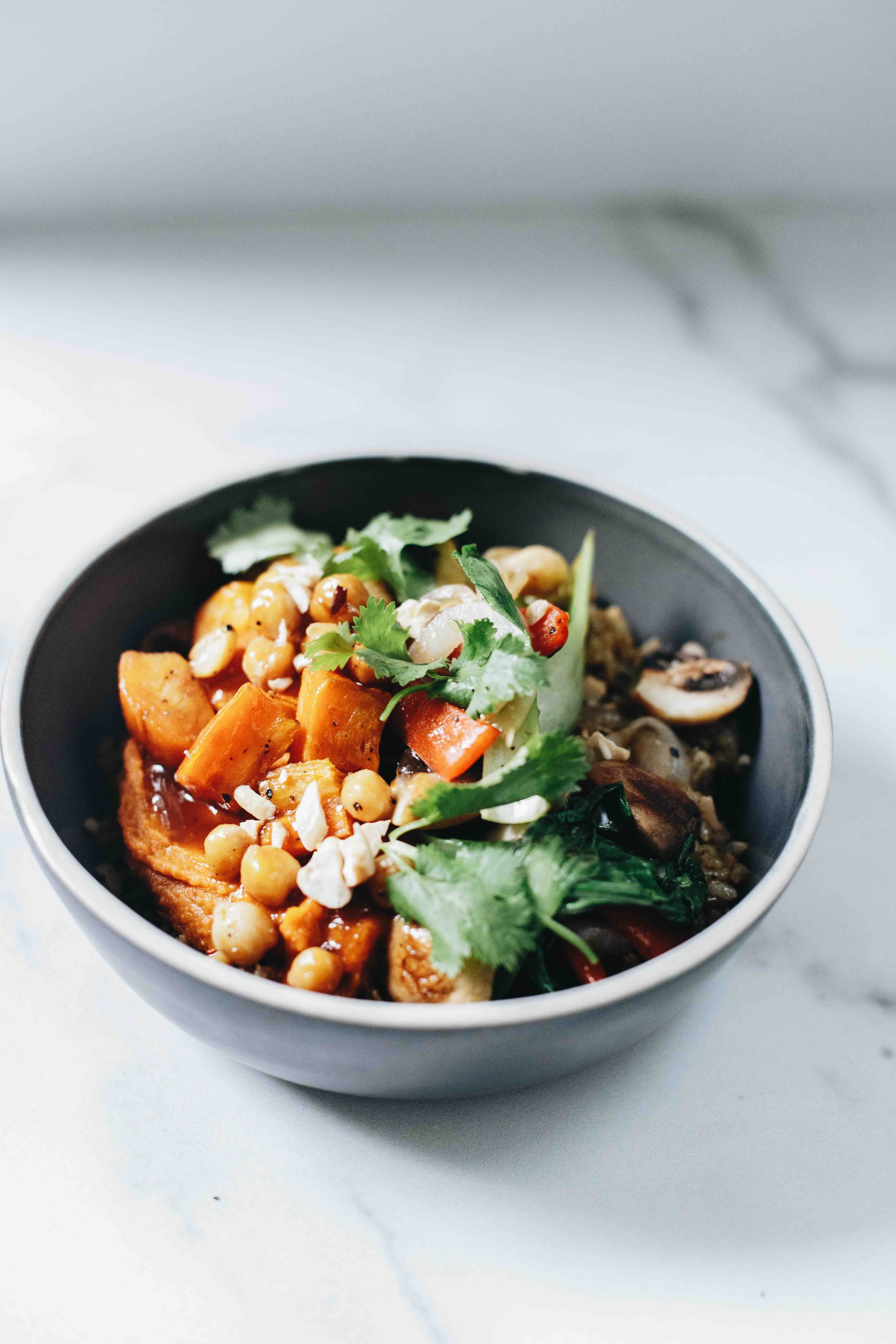 BUDDHA BOWL A bold mix of bagoong rice, roasted sweet potatoes, stir-fried vegetables, chickpeas, sweet potato purée, curry sauce, and a tangy tamarind glaze.jpeg