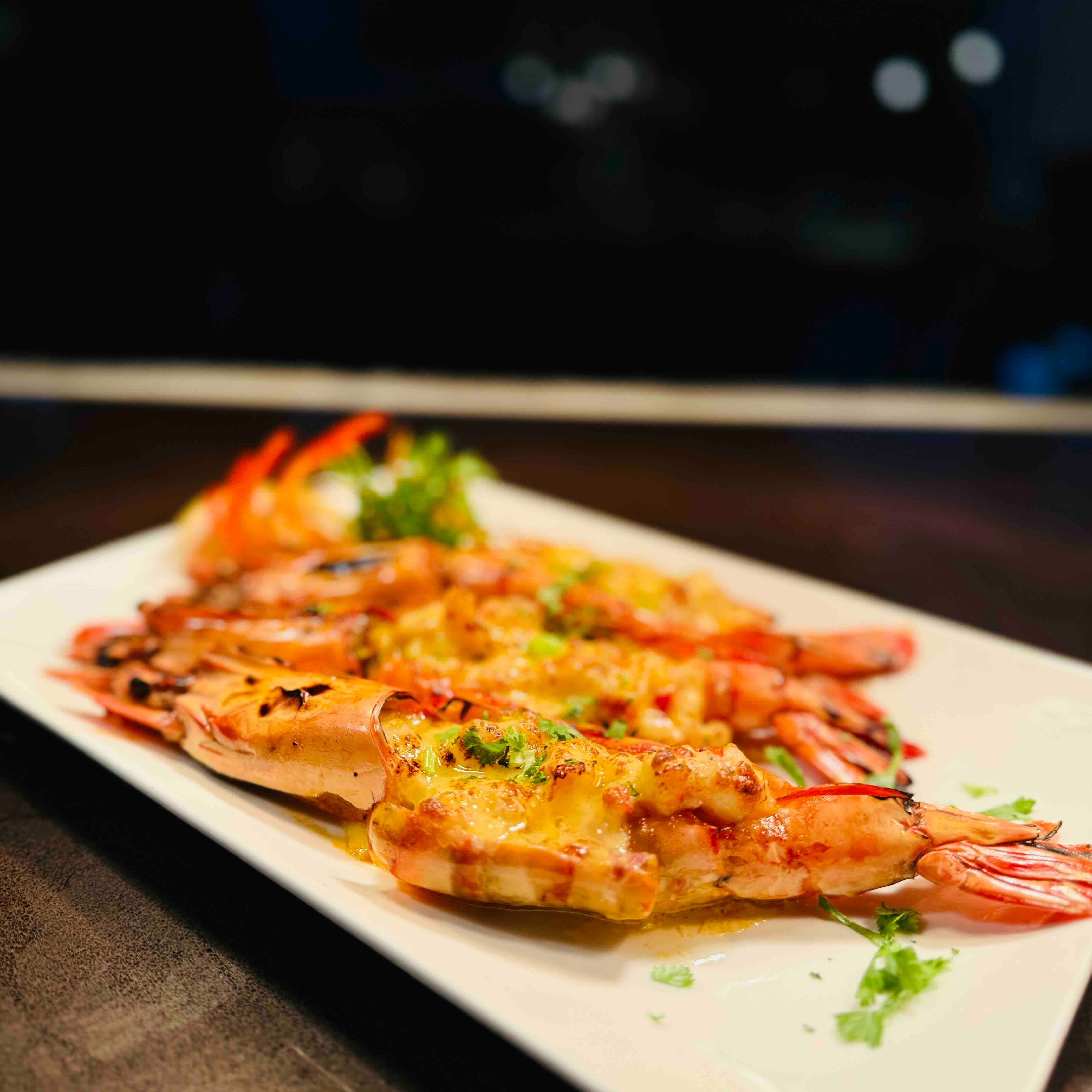 CHEESE-STUFFED PRAWNS Baked prawns slathered in creamy cheese.jpeg