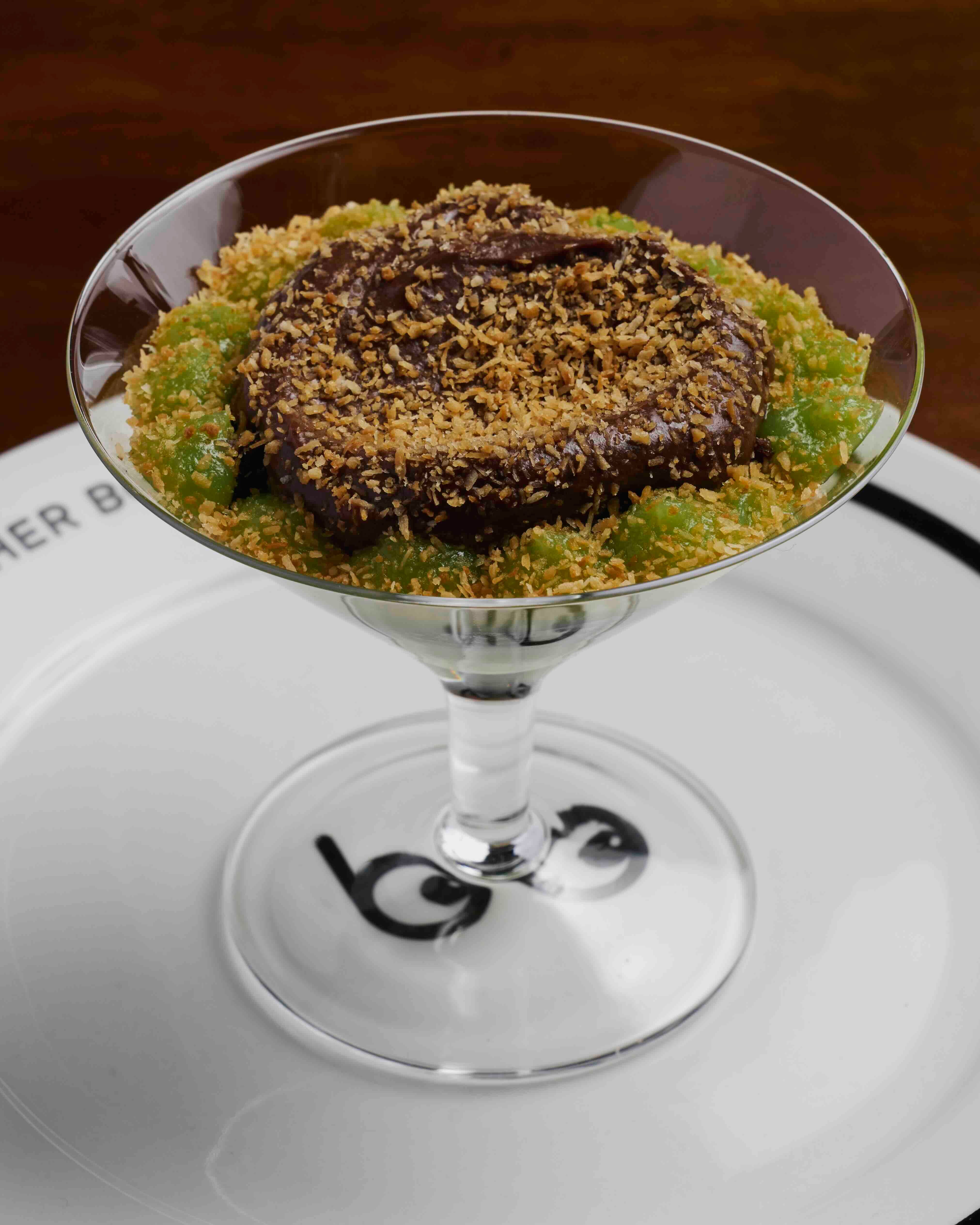 CHOCOLATE AND PANDAN CURD Chocolate mousse and sponge, pandan cream, and toasted coconut for a sweet finish.jpeg