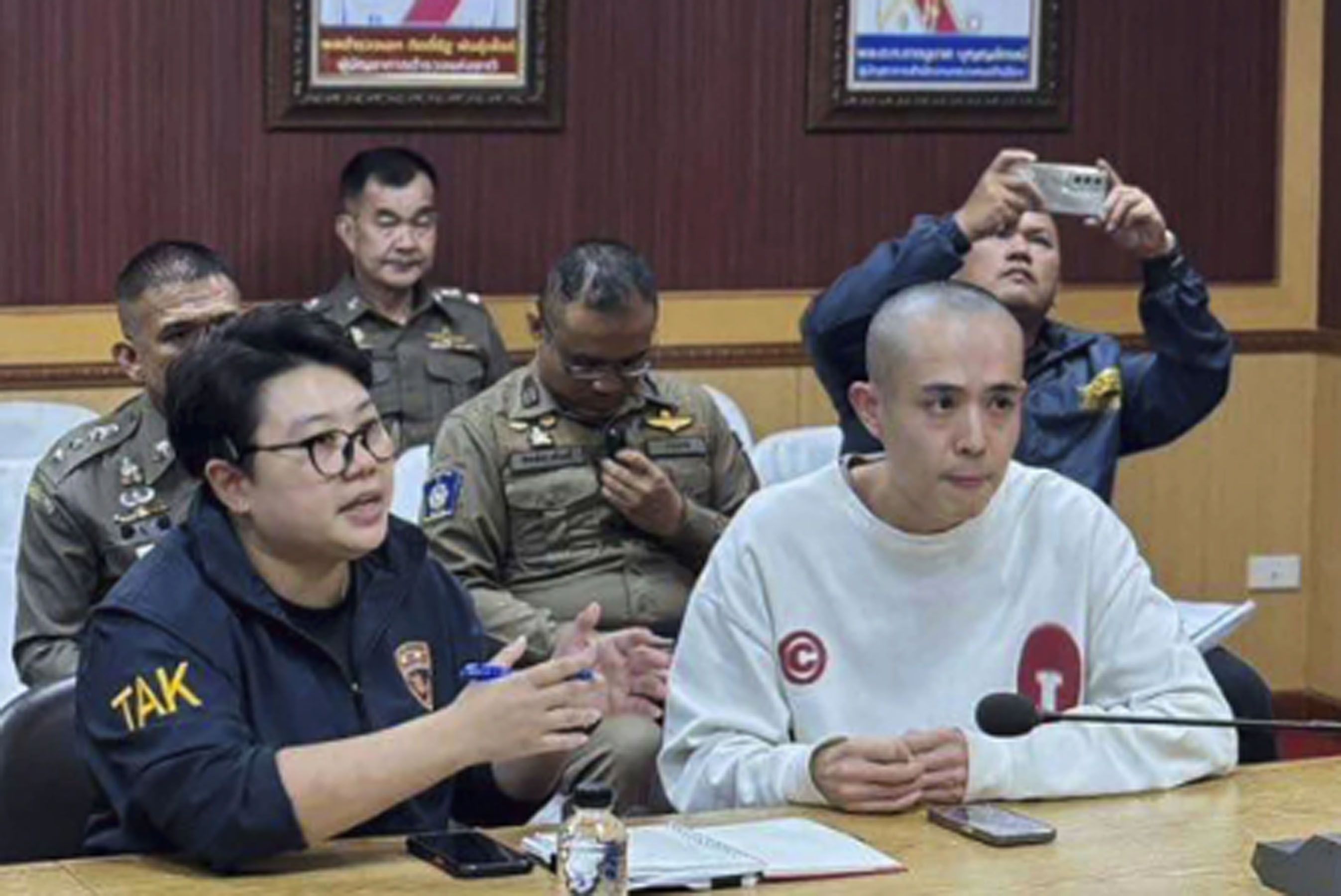 Chinese actor Wang Xing with Thai police (AP).jpg