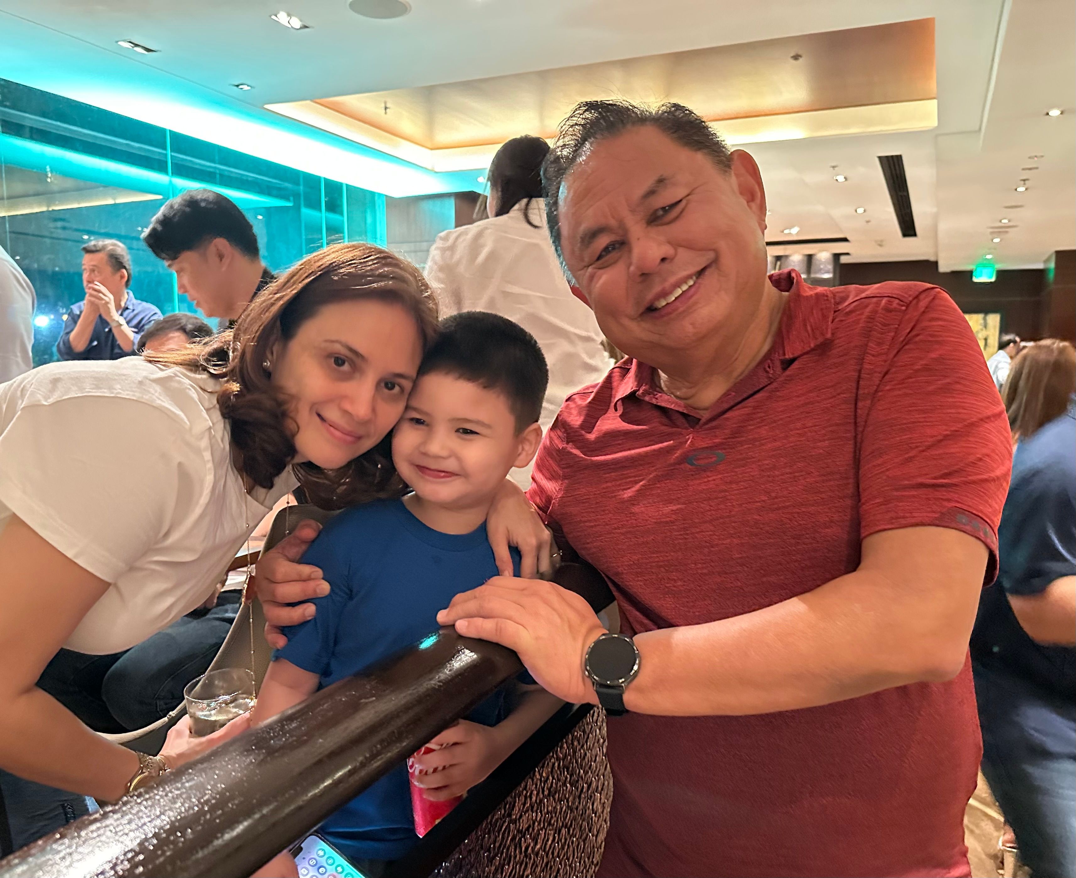 Christine and Dioceldo with their son.jpeg