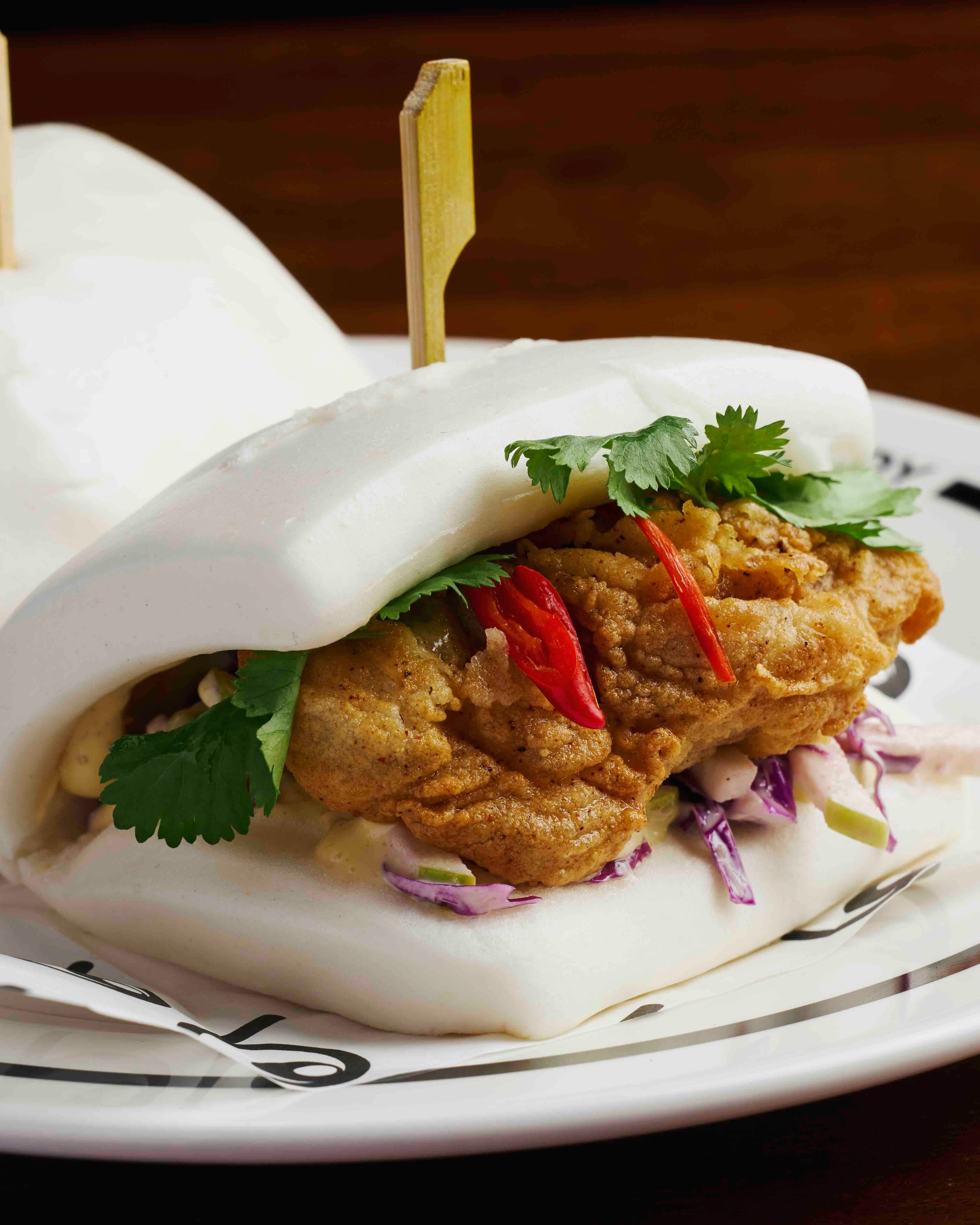 FREID CHICKEN BAO Served with with yuzu koshō mayo and apple and red cabbage slaw.jpeg