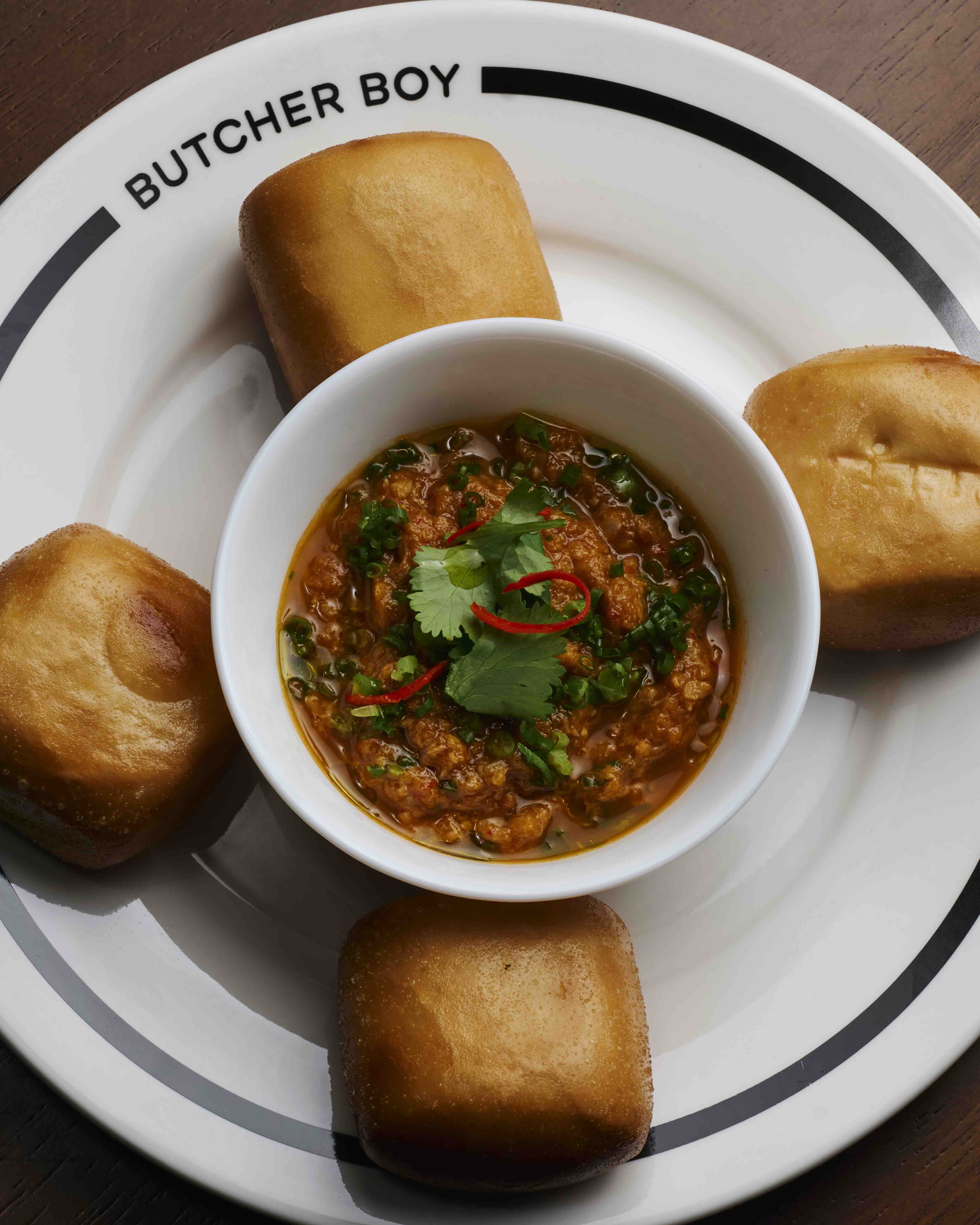 FRIED BUN AND CHILI CRAB SAUCE Mantou buns with chili crab sauce thick with fresh crab meat.jpeg