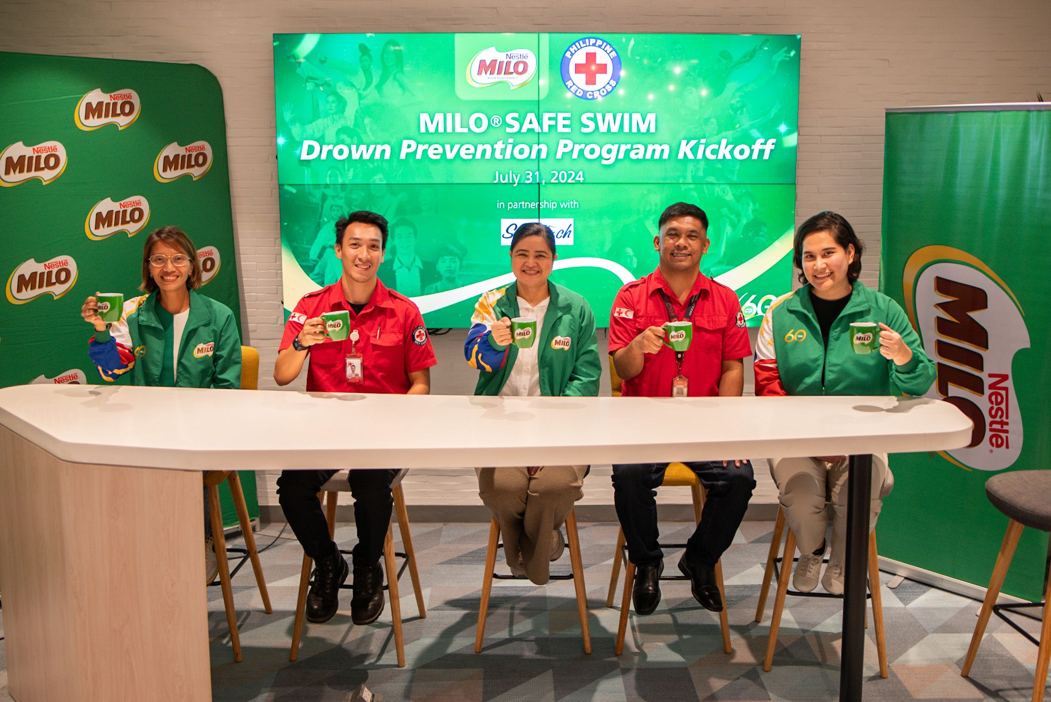MILO Safe Swim Stakeholders Meeting with MILO Mug Pose.jpg