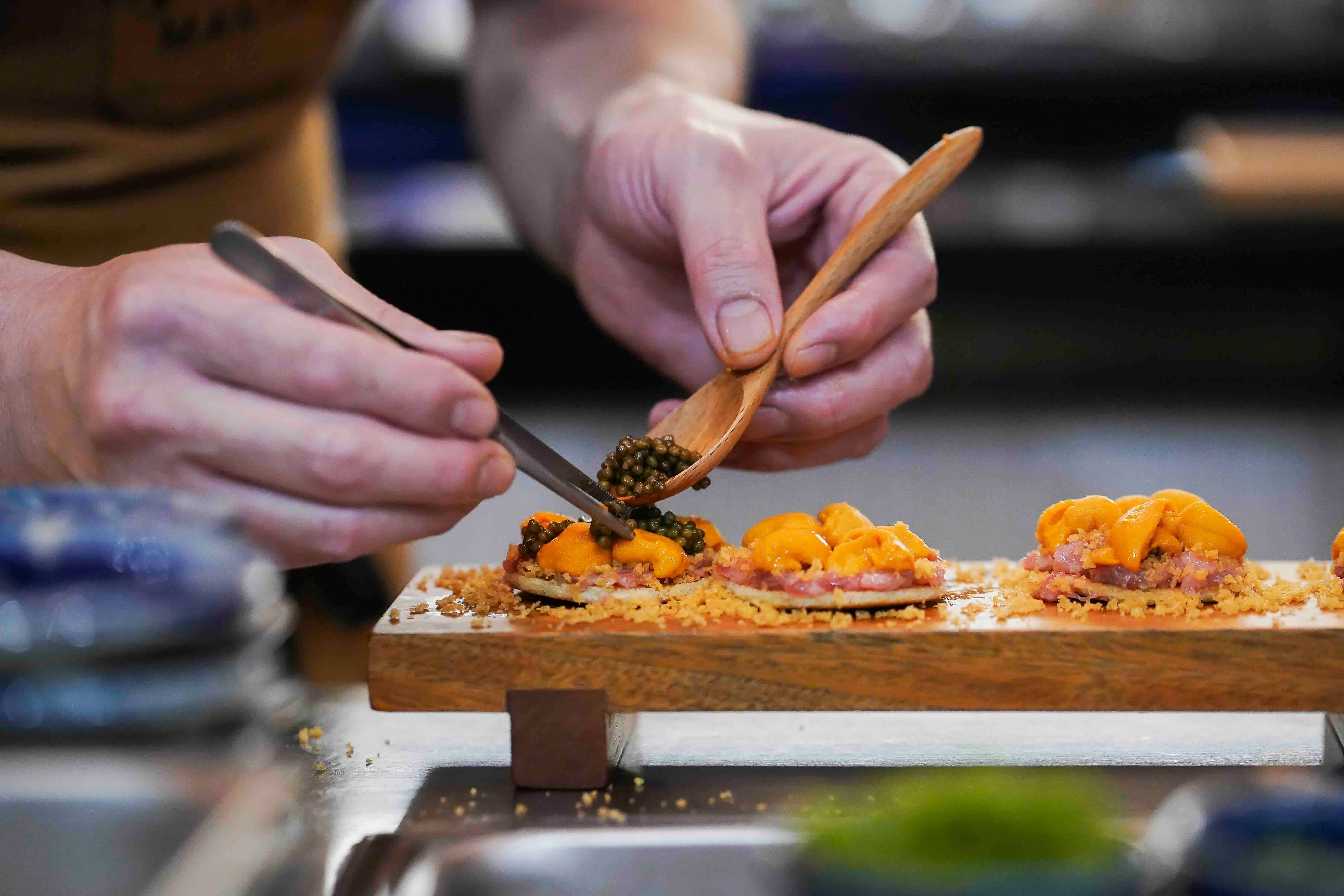 OMOTENASHI Uni caviar toast, toro, bottarga, and ikura..jpeg