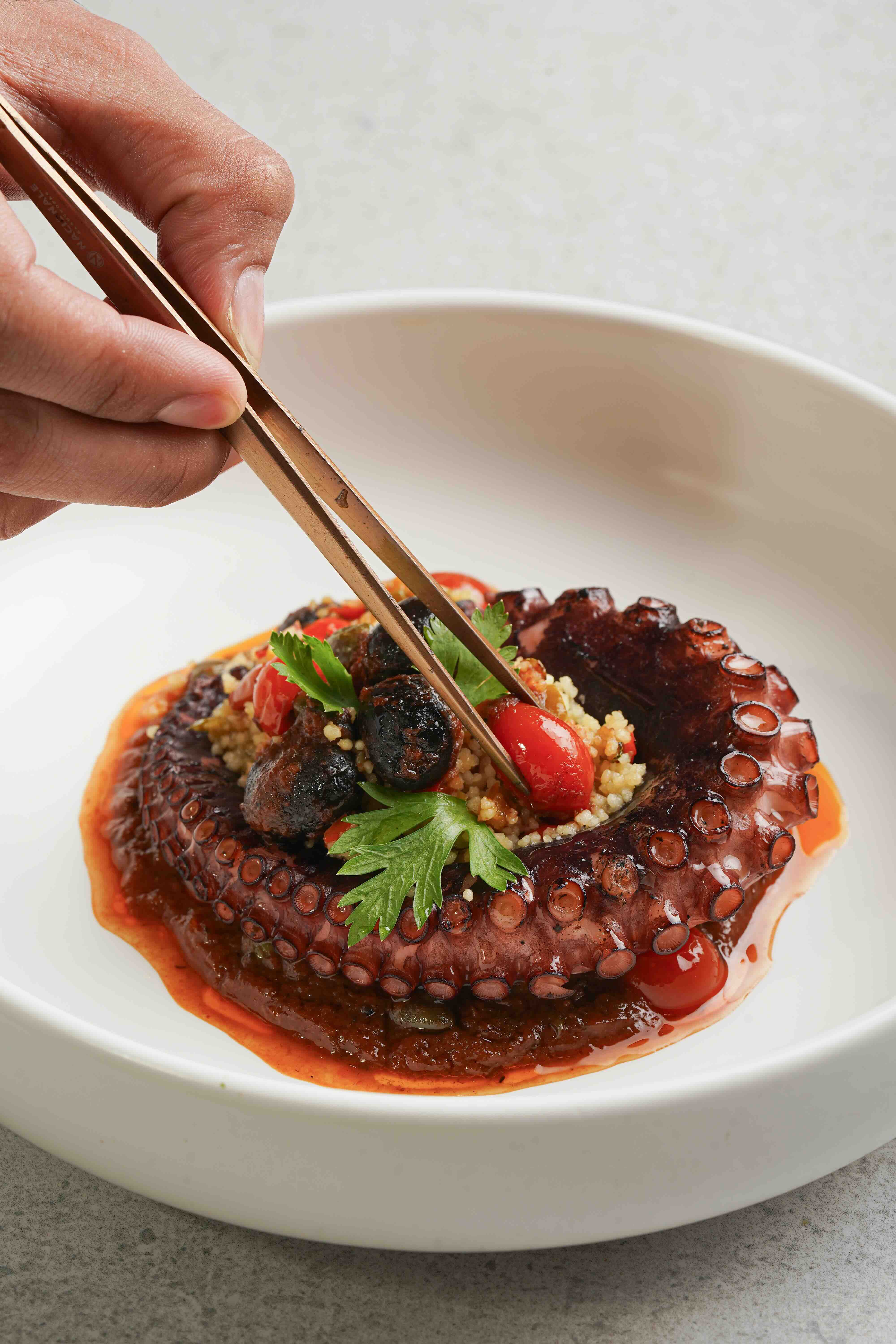 POLPO ALLA LUCIANA Perfect for lent, octopus paired with couscous, capers, and cherry tomatoes (1).jpeg