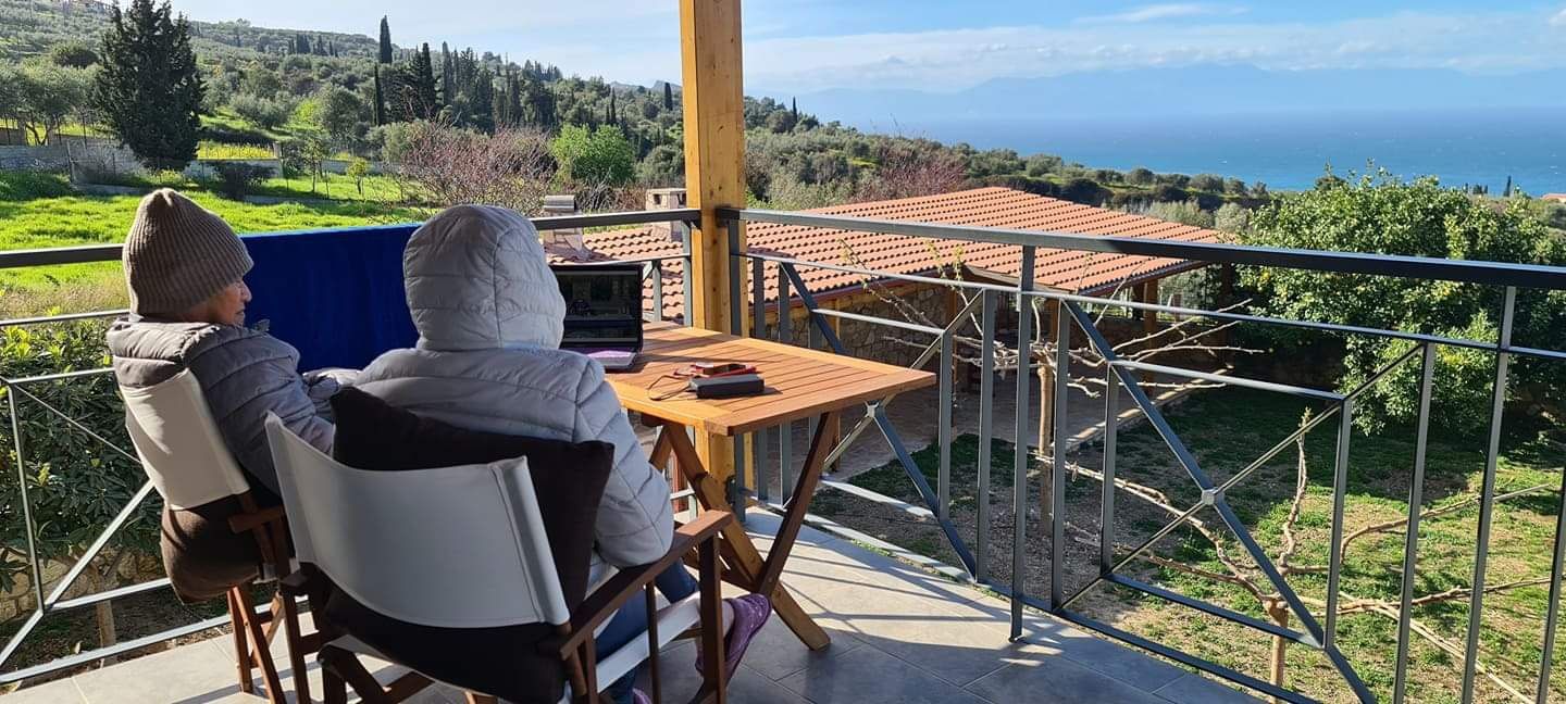 Papa and Mama at the balcony enjoying sunshine in winter.JPG