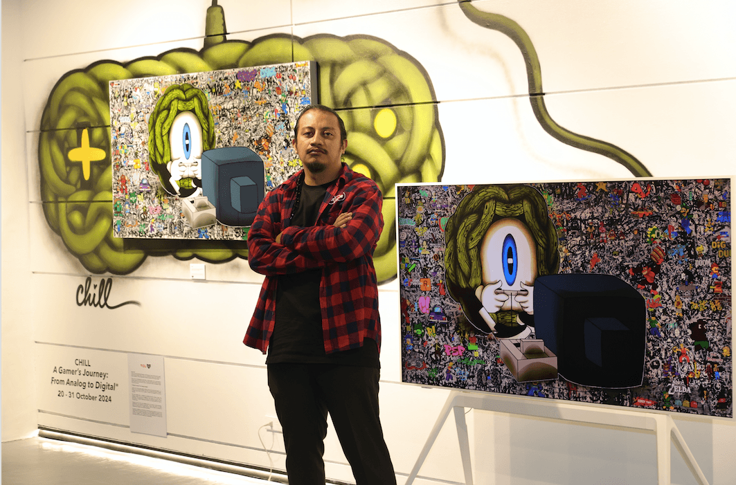 Prominent Filipino graffiti artist, Chill, in front of A Gamer's Journey.png