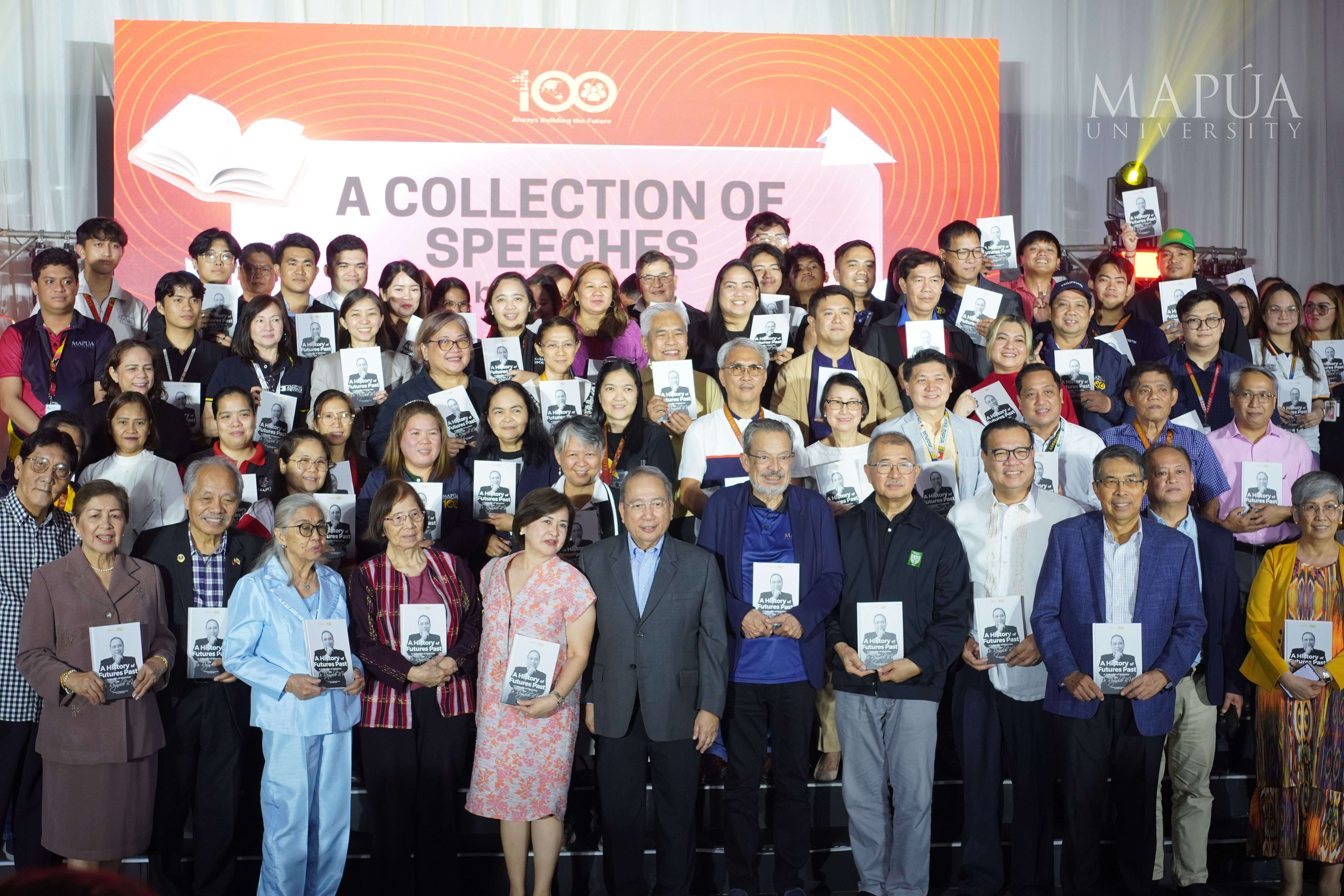 The Mapúa community and guests pose for a photo op after getting a copy of Dr. Vea’s book.jpg