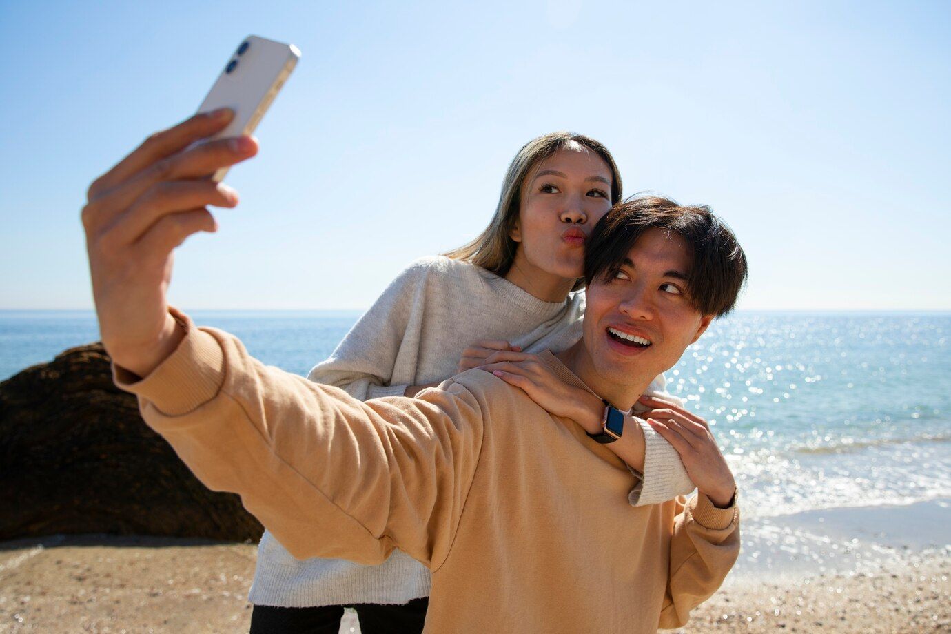 front-view-couple-taking-selfie-beach_23-2150439199.jpg