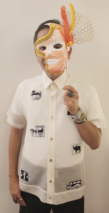 The author wearing a signature MassKara smile at the MassKarade Ball.jpg