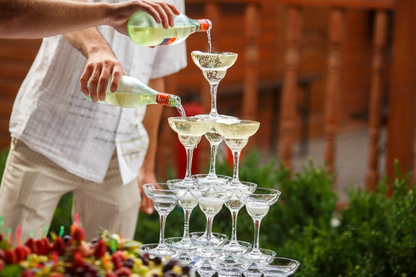 waiters-pour-champagne-pyramid-wineglasses_8353-23.jpg